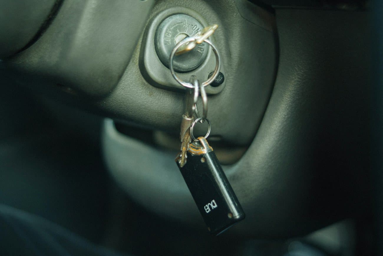 Car keys hanging from the ignition inside a locked vehicle